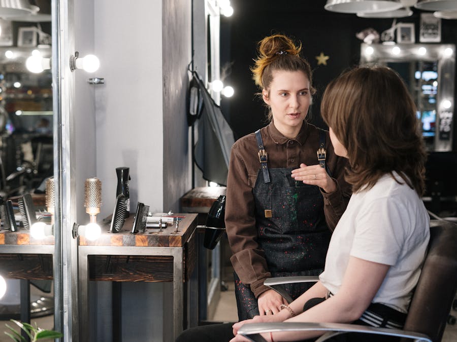 Stylist consulting with a client in the salon